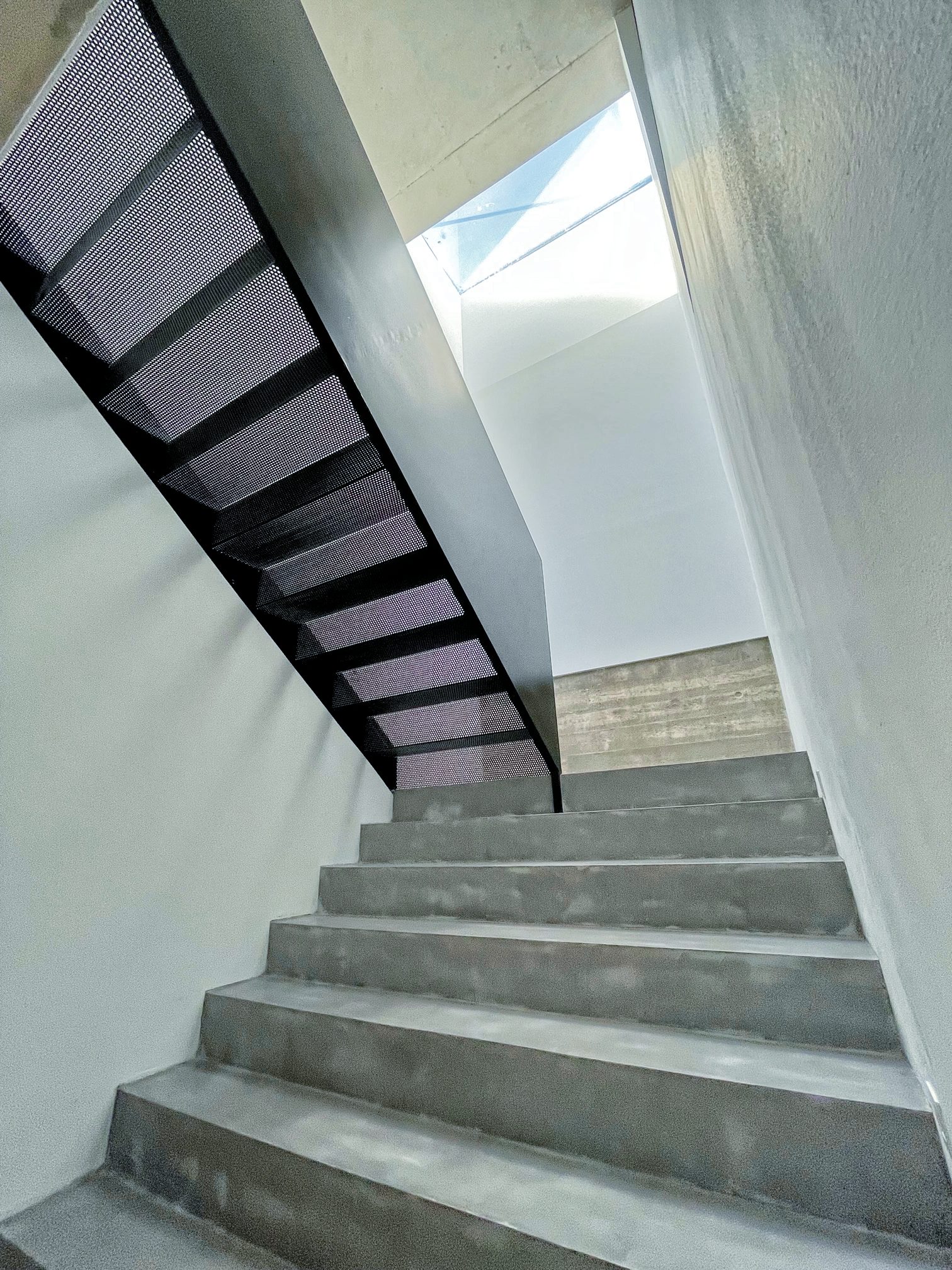 Casa # — Escalera lucernario